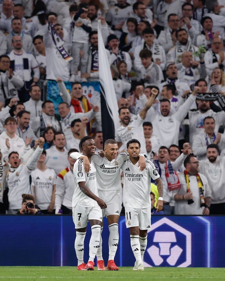 Vinicius, Mbappé and Rodrygo celebrates in a real Madrid shirt