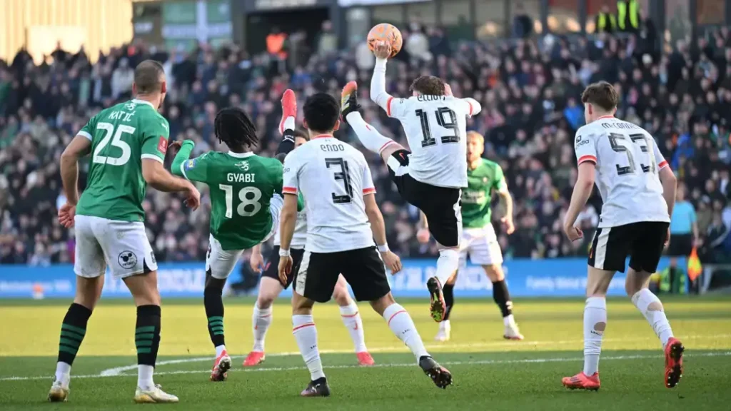 Defeat: Liverpool Crashes Out of FA Cup, A Humiliating Exit to Rock-Bottom Plymouth Argyle 1 Elliott Handball that Led to the Defeat