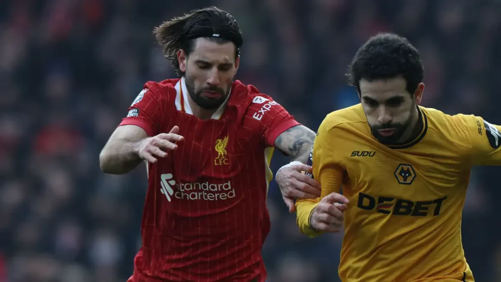 Liverpool's Gritty Victory Over Wolves: Diaz and Salah Shine as Reds Extend Premier League Lead to 7 Points 2 Szoboszlai in action against Wolves