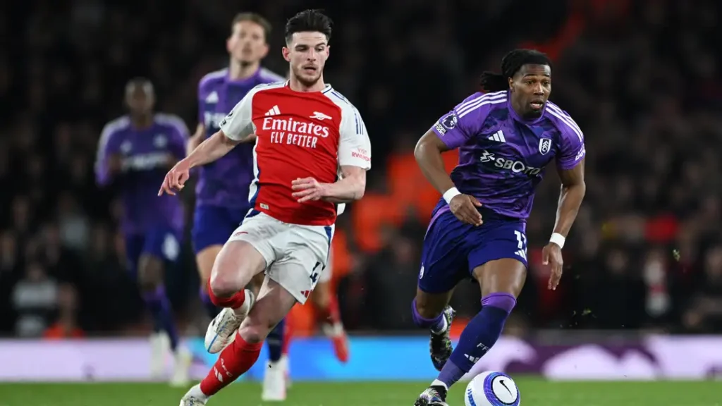 Saka Shines in Arsenal’s Rollercoaster Night Against Fulham: A Tale of Triumph and Tragedy 3 Rice in action for Arsenal